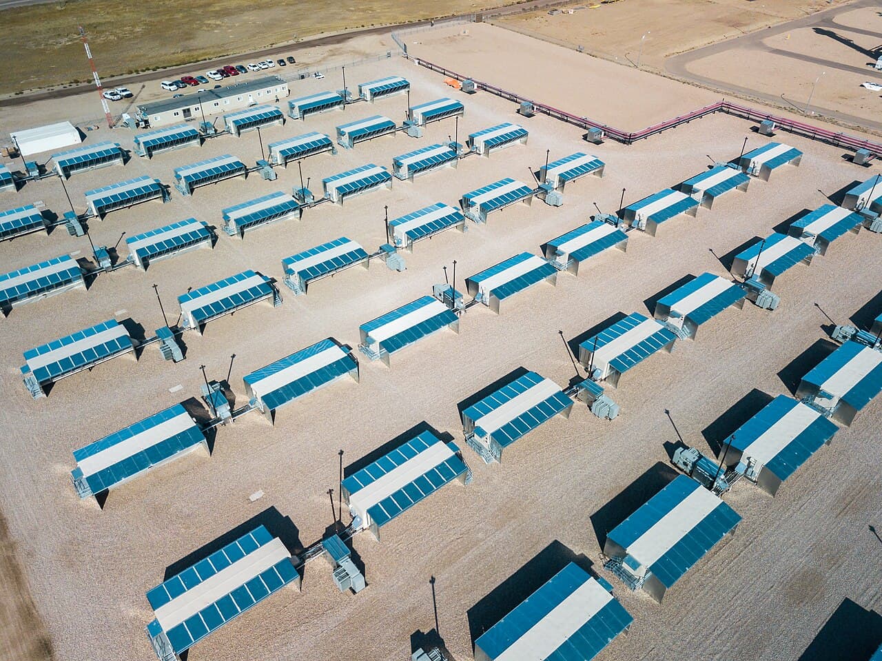 Aerial view of rows of mining containers on a gravel site